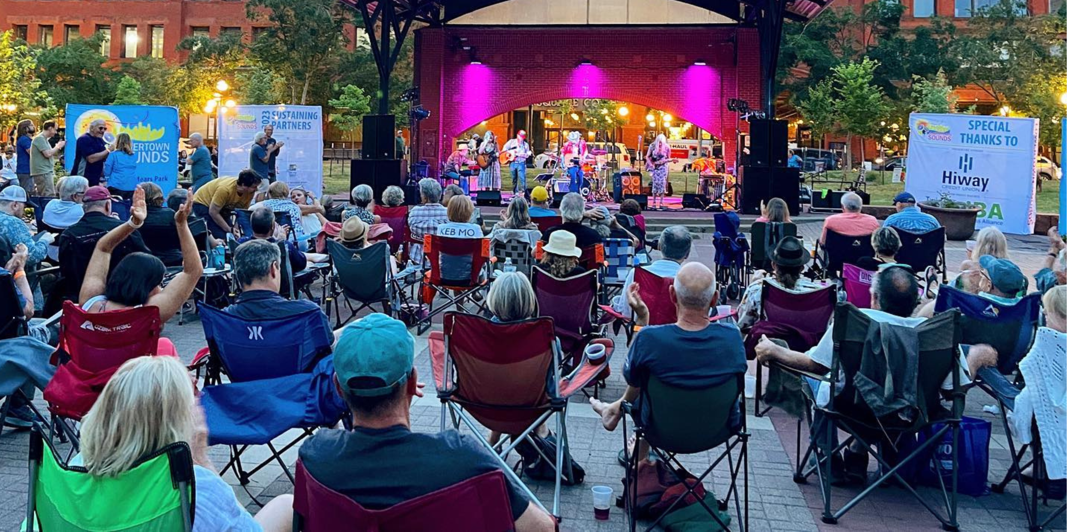 A crowd of people in camping chairs watched a live concert downtown Saint Paul in Mears Park.