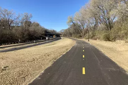 Photo of newly constructed bike and pedestrian trail along the east side of Ayd Mill Road and the newly resurfaced north and south bound vehicle lanes.