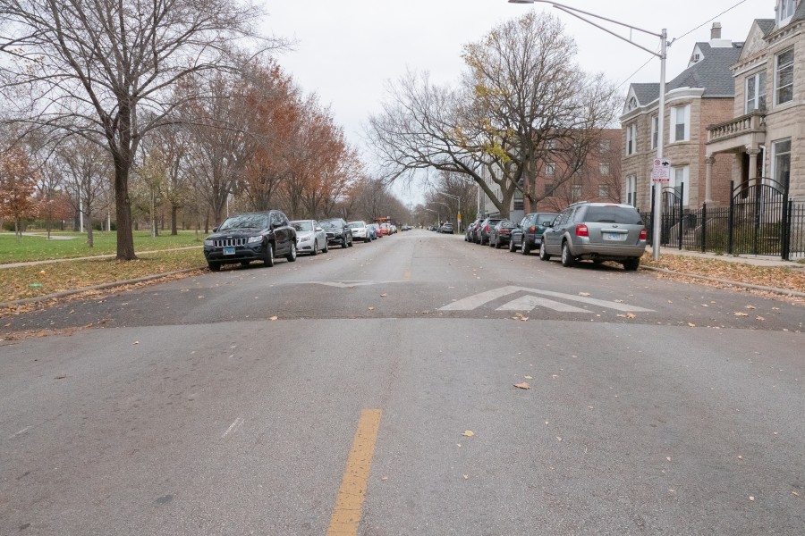 Street with a speed bump on it.