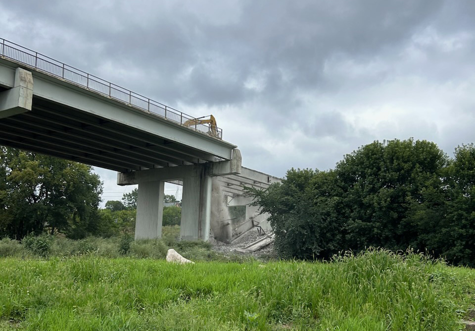 Demolishing concrete bridge