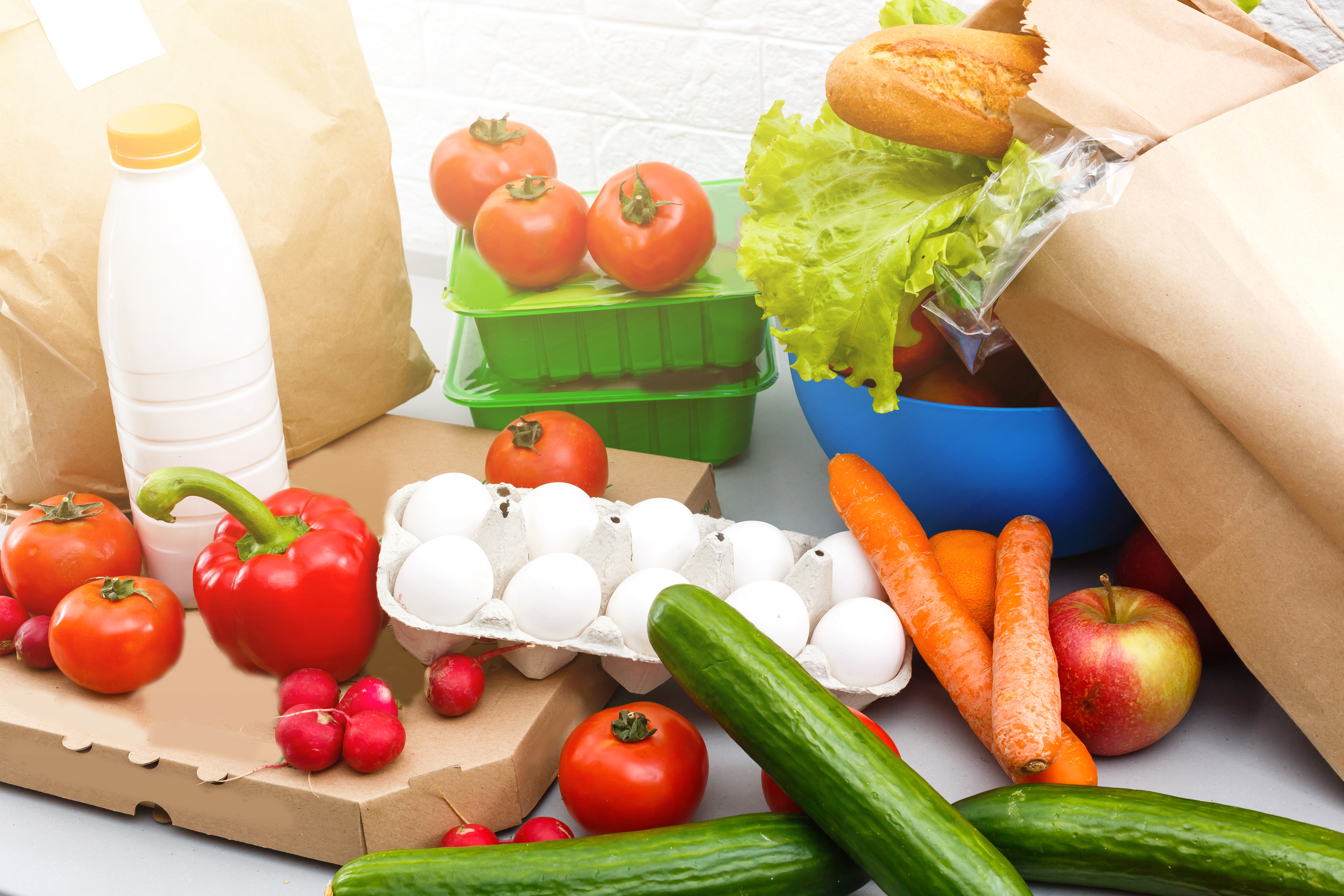 Image of fresh vegetables and groceries on a table