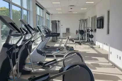 Elliptical and stationary bike equipment in fitness center