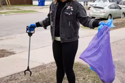 a woman picking up litter