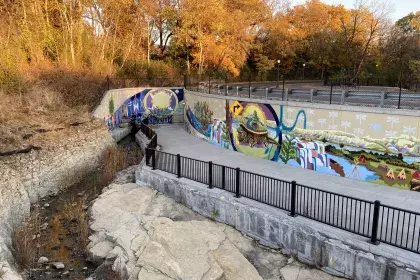 Mural titled “As Above, So Below; Seeing Ourselves in the Creation Story" within Uŋčí Makhá Park 